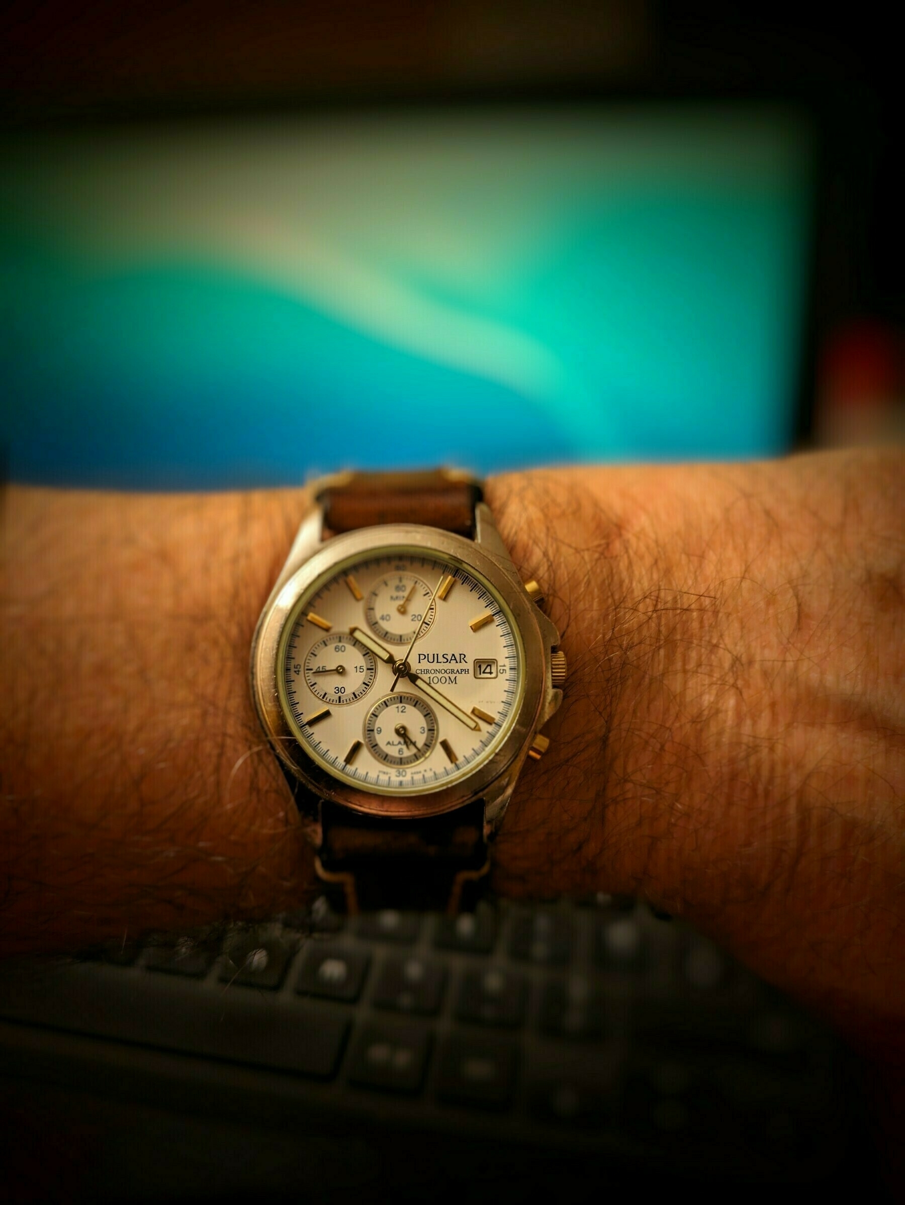 My old Pulsar Chronograph analogue watch on my hairy wrist with a brown leather strap